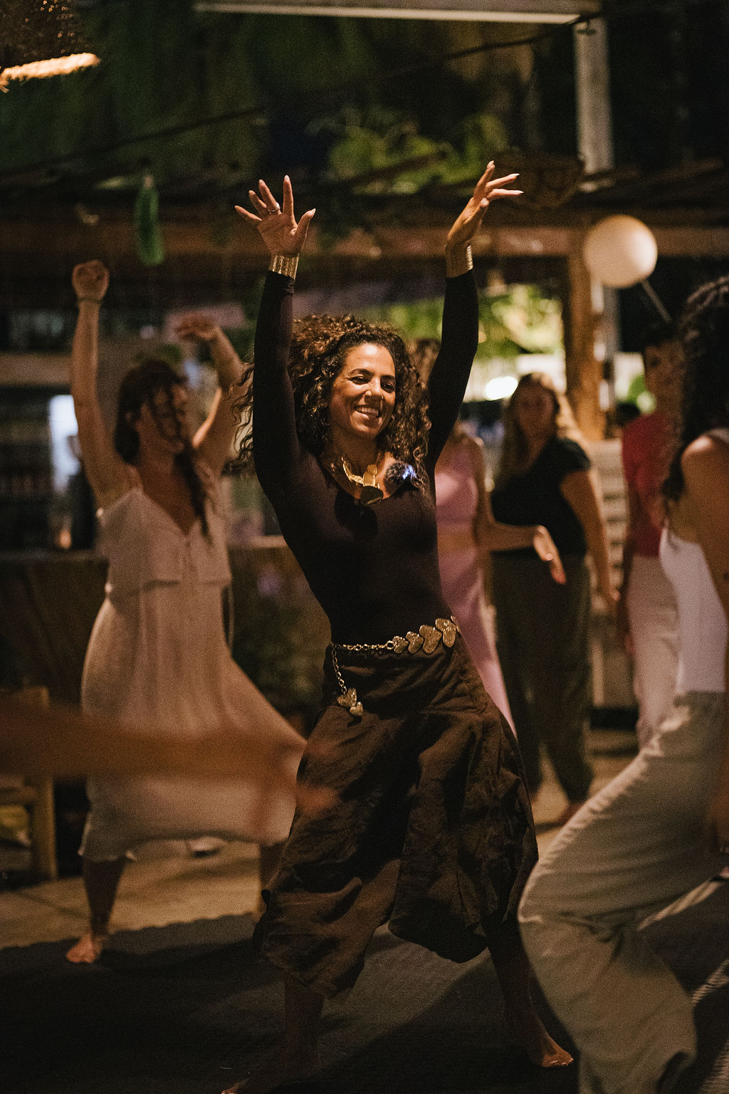 Yarin leading a somatic dance circle with women